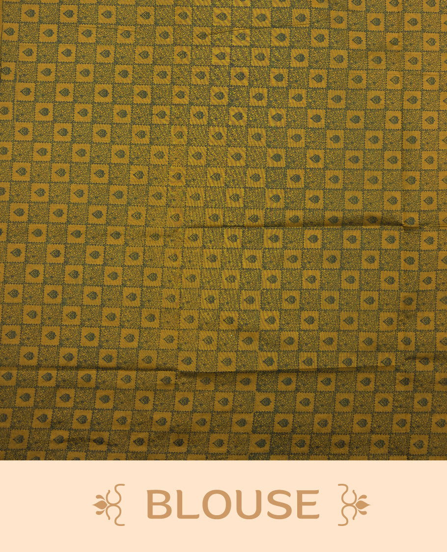 Dark Mustard colour poly cotton saree with black vertical dotted line pattern on the body, paired with a matching pallu featuring zigzag geometric border, and a coordinated all‑over black stylised fleur‑de‑lis printed blouse piece.