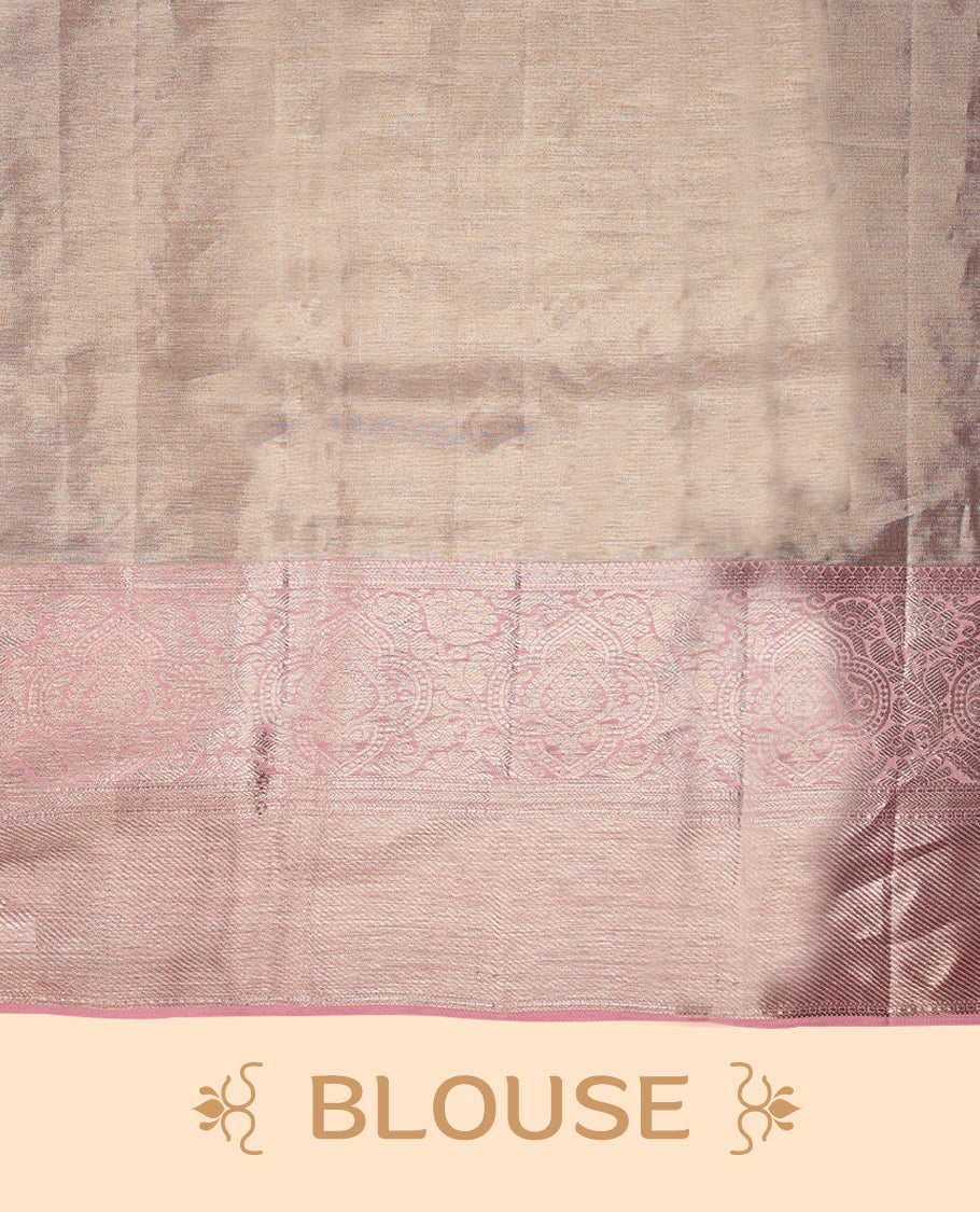 Baby pink Colour Kancheepuram tissue silk saree featuring intricate silver zari floral work on the body, complemented by a contrasting traditional border and a matching blouse.