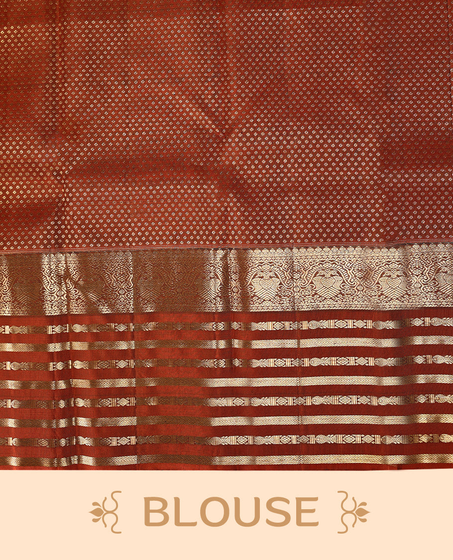 Muted lavender-grey Colour traditional Kancheepuram silk saree adorned with antique zari double peacock motifs on the body, rust red traditional border with alternating horizontal gold zari stripes and ornamental weaving , with a matching blouse.