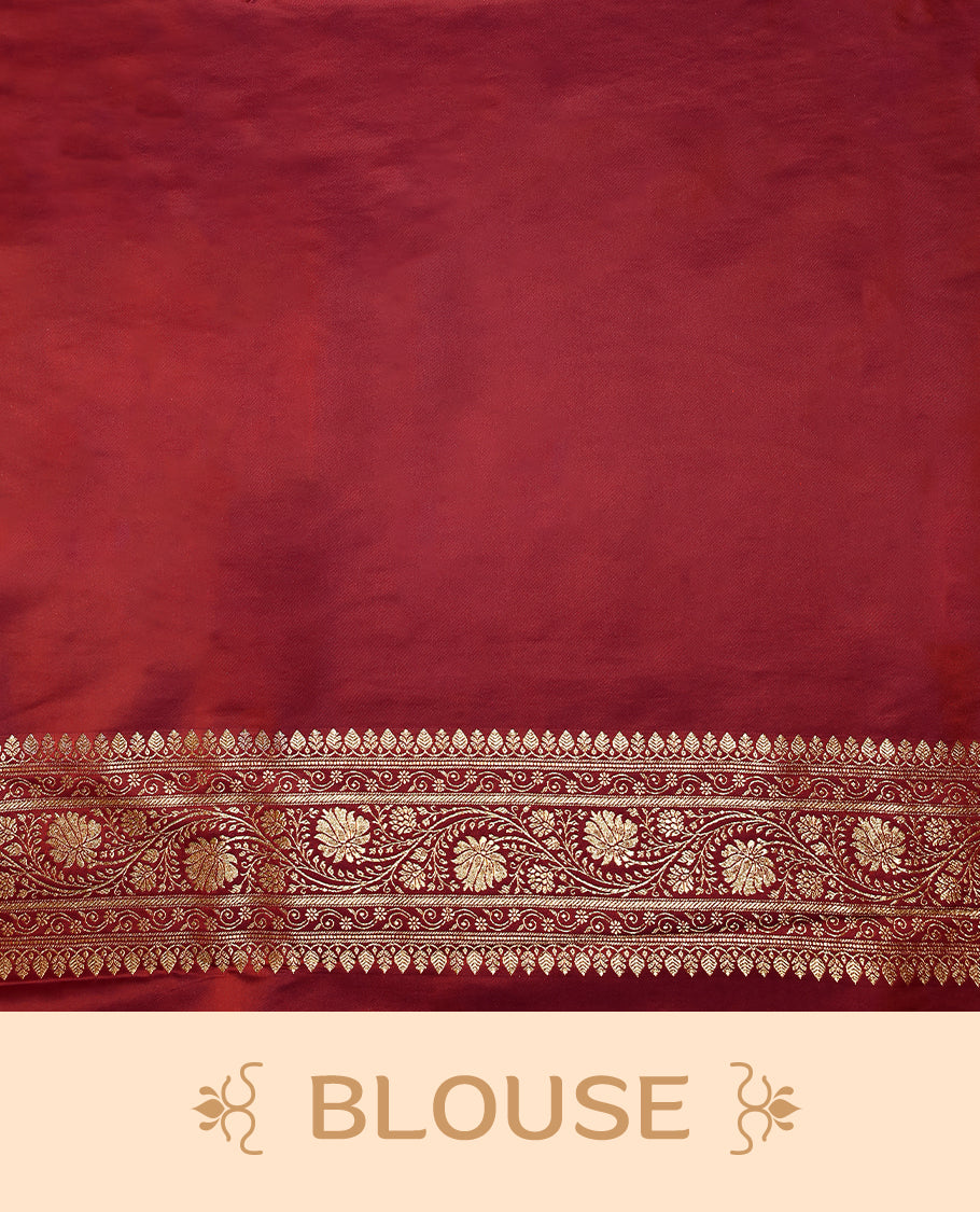 Deep red colour semi Banaras satin crepe saree featuring gold zari woven flower motifs across the body, complemented by an intricately designed traditional banarasi border and richly woven pallu, paired with a matching blouse piece.