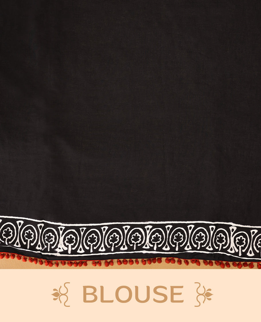 Black cotton saree features intricate white handblock prints, a beautifully detailed border with red piping and Self Coloured Blouse