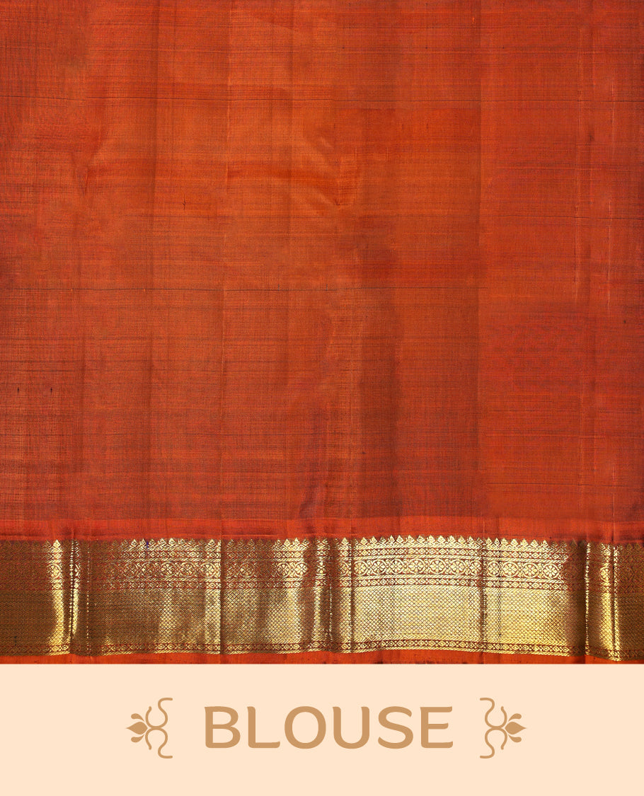 Bottle green colour pure Kancheepuram saree with gold zari traditional paisley motifs on the body contrast traditional border grand pallu with diamond pattern paired with matching blouse