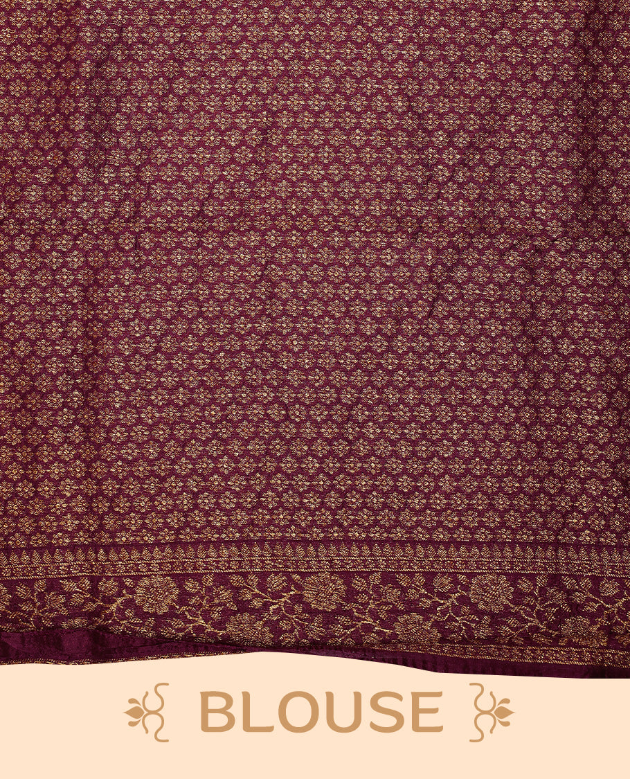 Maroon colour Tussar Banaras saree featuring a plain body, rich floral woven zari border and grand pallu, paired with a matching blouse for an elegant and regal traditional look.