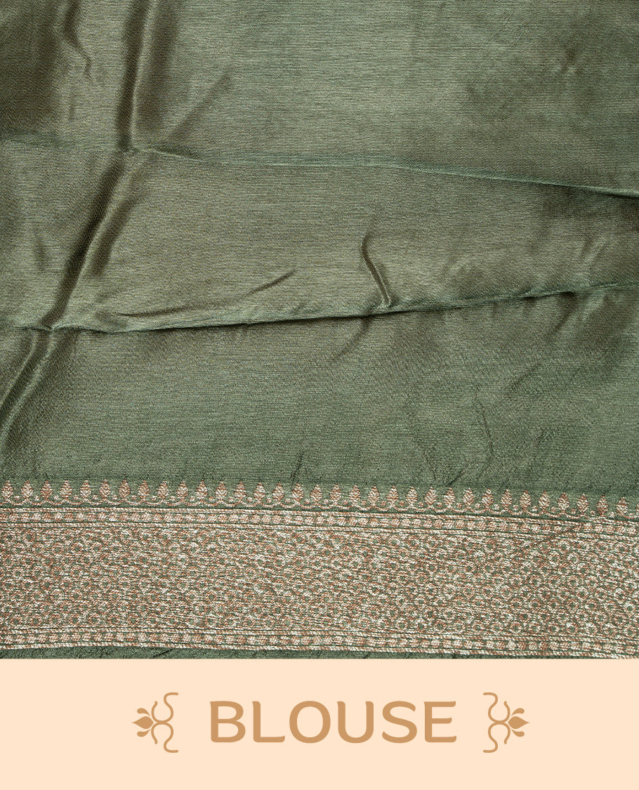 Green colour Semi Banaras Tussar Georgette Featuring Gold zari Leaf pattern on body, Finished with Gold zari border and paired with matching blouse piece.