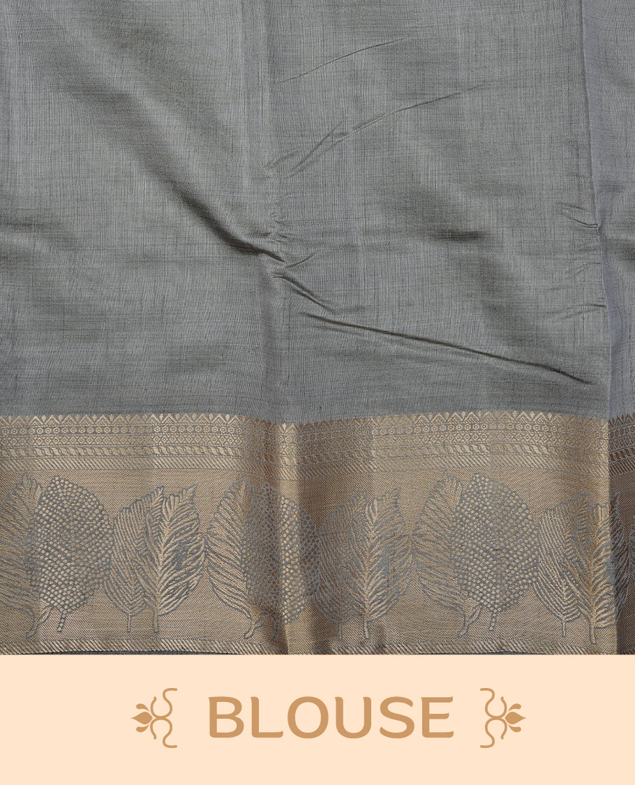 Gray colour semi tussar silk saree featuring an elegant plain body with traditional gold zari detailed border for a refined look. Comes paired with a matching blouse piece.