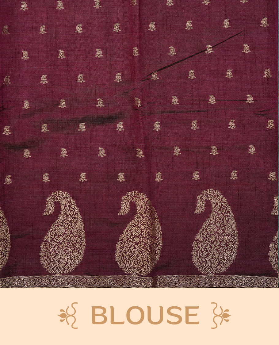 Chocolate brown colour semi tussar silk saree featuring small gold zari mango motifs across the body, enhanced with a self colour border showcasing elegant gold zari mango patterns. Paired with a matching blouse piece.
