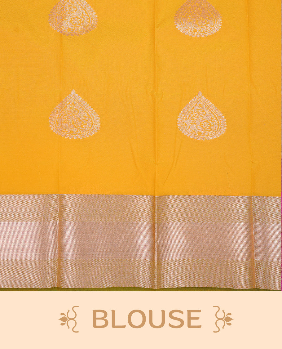 Mustard yellow colour Semi silk saree Featuring gold zari motifs on body, complemented by contrast green colour with gold zari border, paired with matching blouse piece.