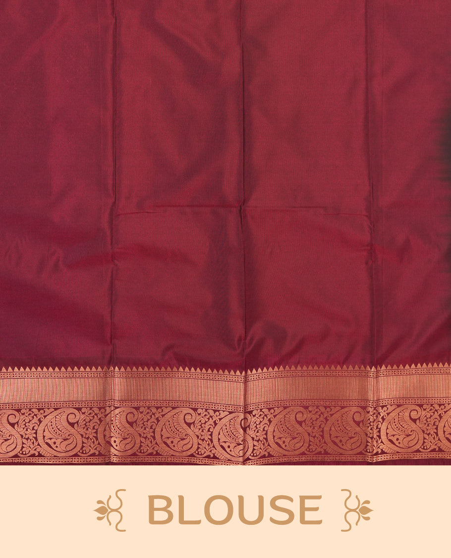 Teal colour Semi Silk Saree with gold zari motifs on the body, paired with a contrast Dark maroon colour pallu with gold zari traditioal border, and a matching blouse piece.