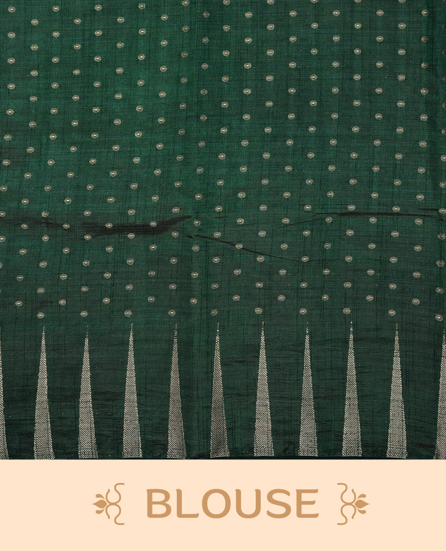 Green colour semi tussar silk saree featuring gold zari dot motifs all over the body, highlighted by a self colour border with intricate gold zari temple patterns. Comes paired with a matching blouse piece.
