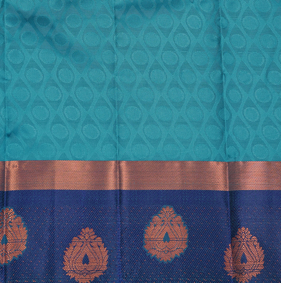 Teal green colour Semi silk saree Featuring self colour zari pattern on body, complemented by contrast Blue colour with gold zari border, paired with matching blouse piece.