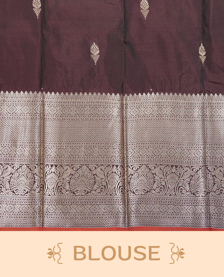 Dark chocolate colour Semi silk saree Featuring gold zari motifs on body, complemented by Self colour with gold zari border with dark orange edge, paired with matching blouse piece.