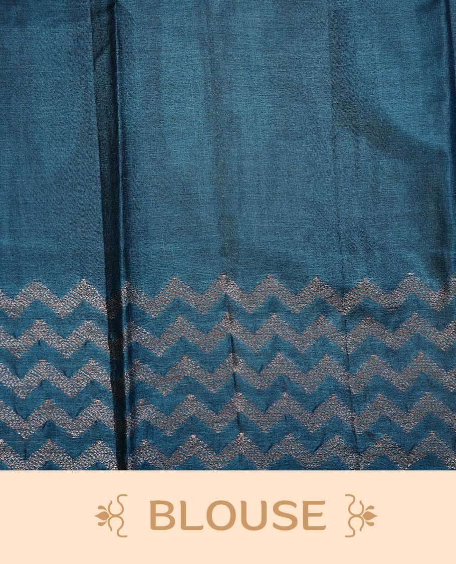 Aqua Colour Tussar silk saree featuring Antique Zari motifs on body, Finished with contrast Teal colour Zigzag zari pattern border, paired with matching blouse piece.