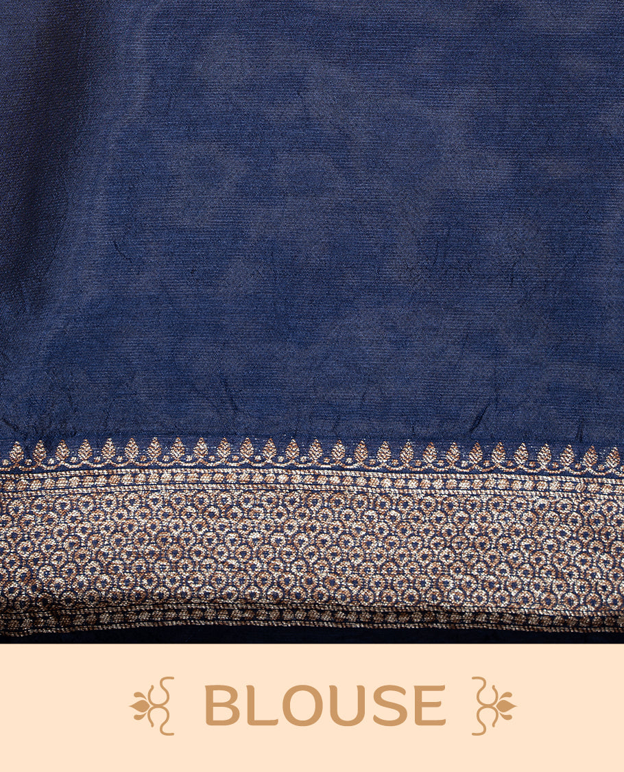 Navy Blue colour Semi Banaras Tussar Georgette Featuring Gold zari Leaf pattern on body, Finished with Gold zari border and paired with matching blouse piece.