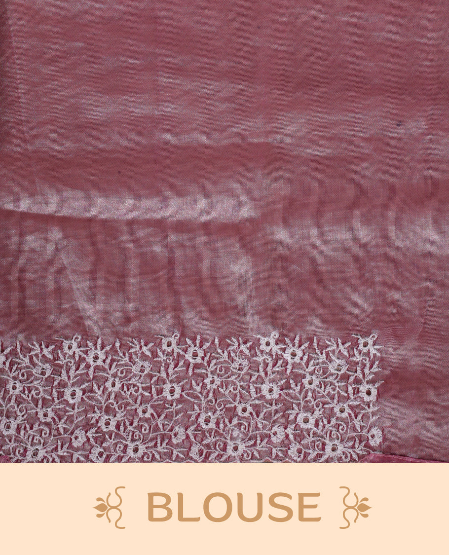 Peach colour net organza designer saree featuring a subtle self patterned body and an intricately scalloped floral thread embroidered border all around, complemented by a coordinating embroidered pallu and paired with a matching blouse.