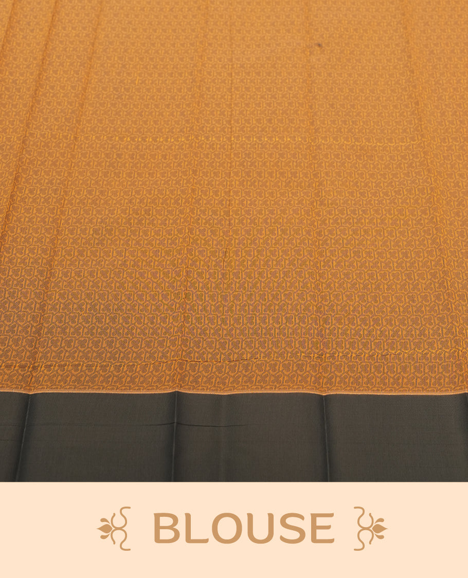 Saffron orange colour silk cotton saree featuring elegant grey floral and geometric woven motifs across the body, paired with a deep contrast grey border and pallu showcasing intricate traditional patterns & Comes with a matching blouse piece.