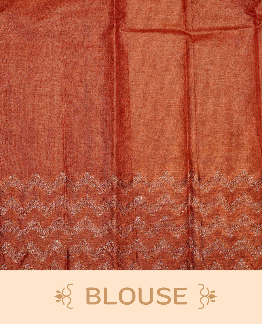 Pale Yellow Colour Tussar silk saree featuring Antique Zari motifs on body, Finished with contrast Orange colour Zigzag zari pattern border, paired with matching blouse piece.