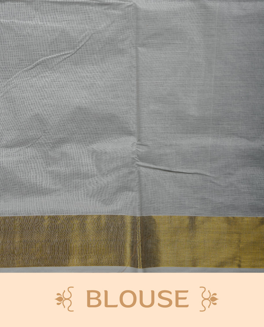 Off white colour cotton Kerala saree featuring colourful geometric motifs, complemented by a classic golden zari border and traditional pallu, paired with a matching blouse.