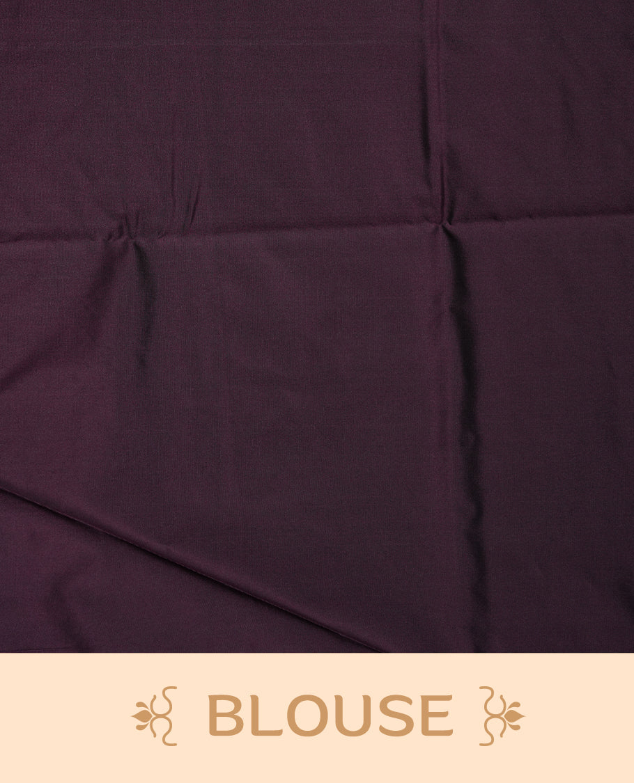 Green colour soft silk saree featuring Antique zari motifs on body with Highlighting contrast Deep Plum colour pallu and paired with matching blouse piece.