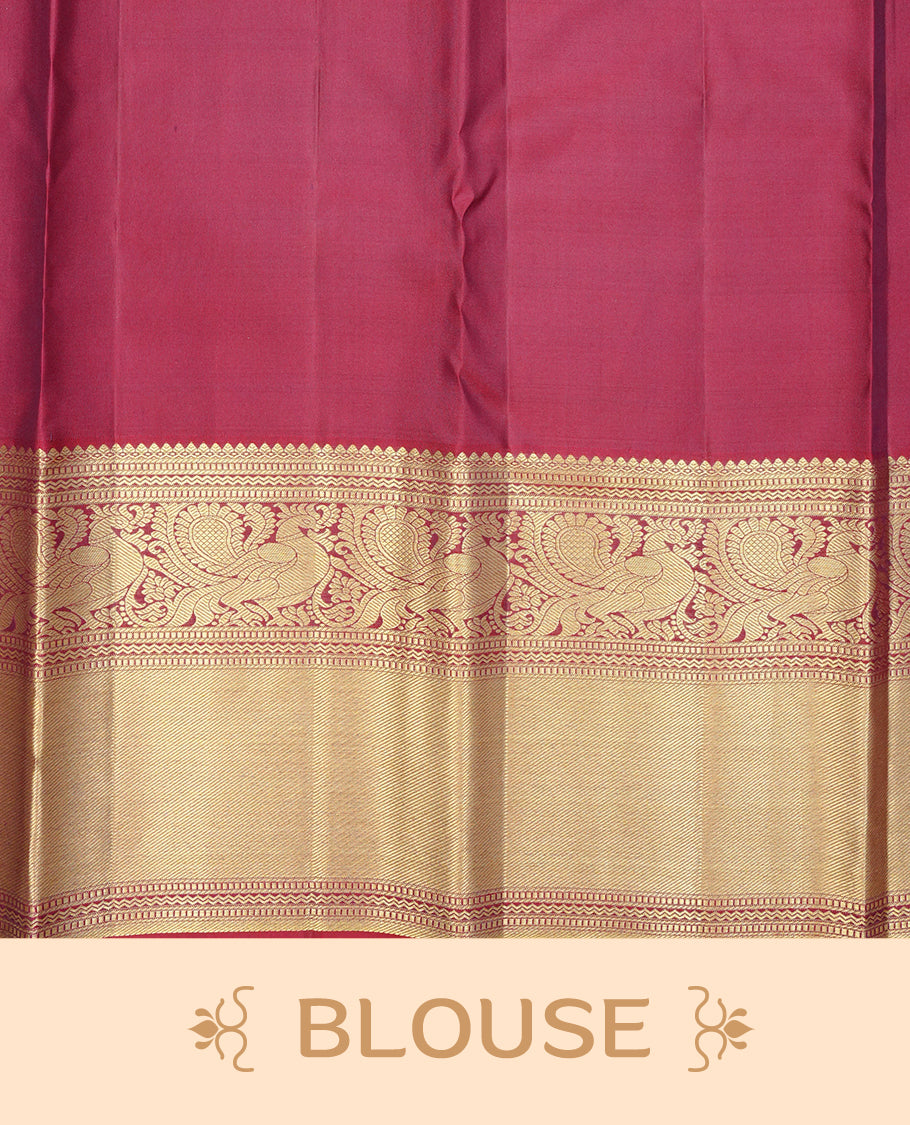 Maroon Colour Pure Wedding silk saree featuring Gold zari Dotted stripes with small buttas on body, complemented by self colour with traditional border, comes with matching blouse piece.