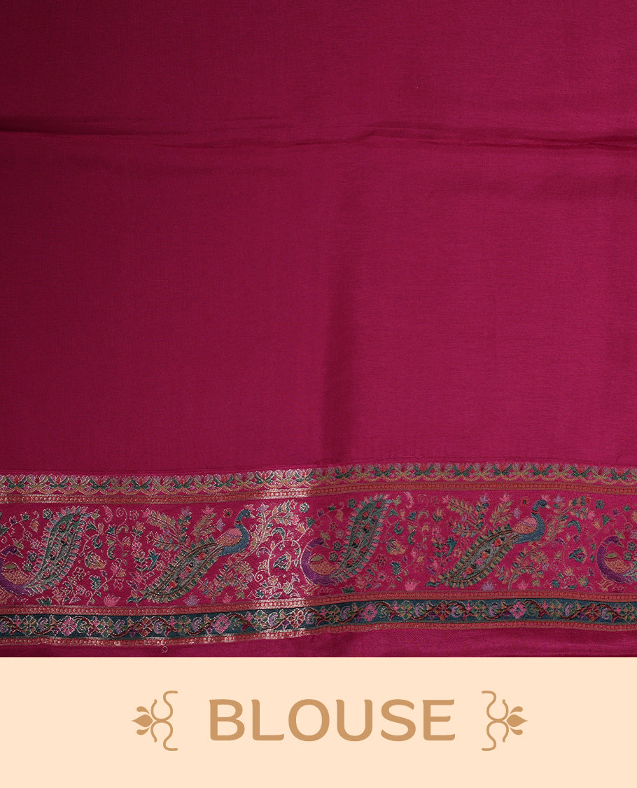 Ivory colour Pashmina silk saree richly woven with all over multicolour dancing figurines and paisley motifs, highlighted by a vibrant pink & green zari border and grand panelled pallu, paired with a matching woven border blouse piece.