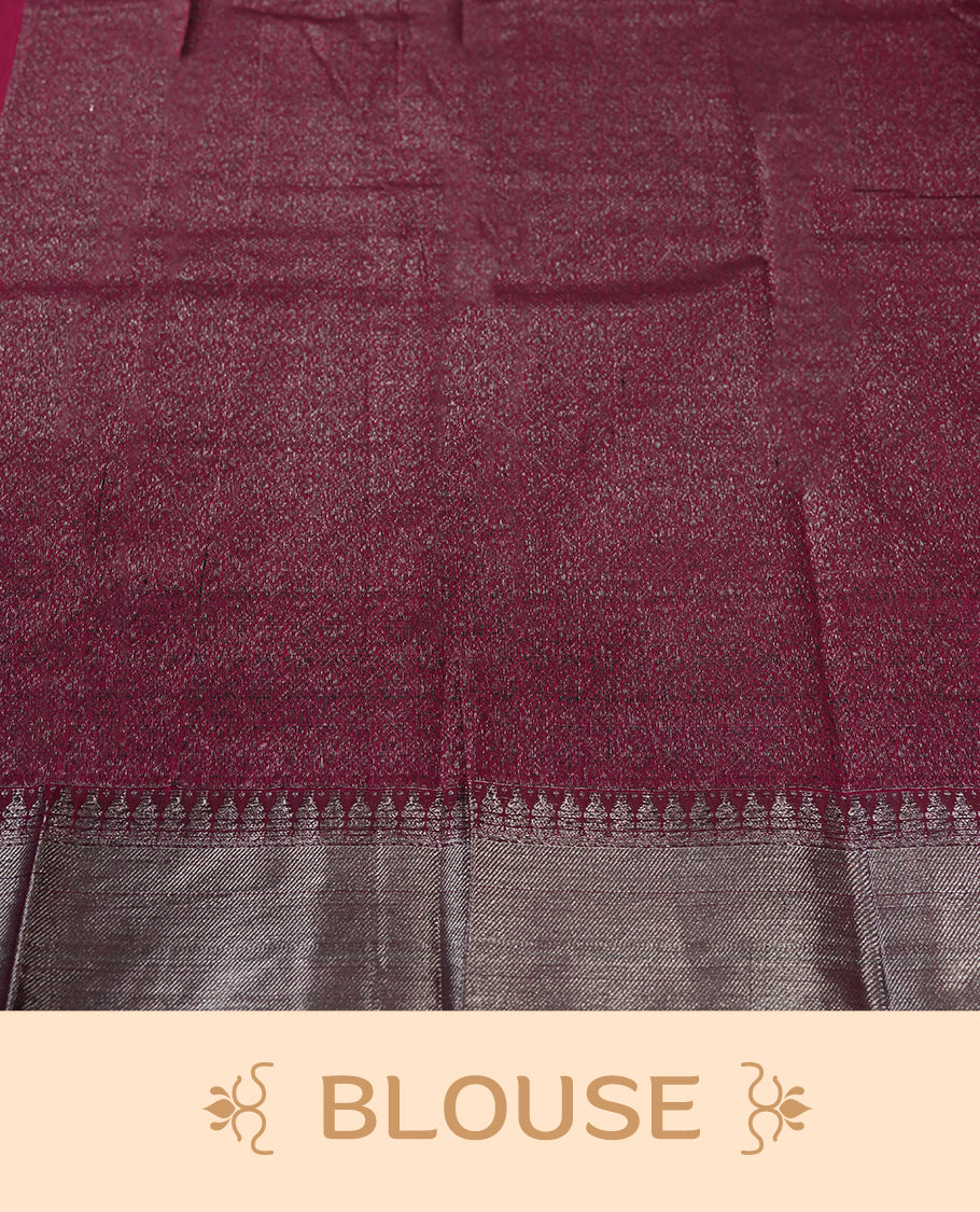 Magenta colour silk cotton saree adorned with a shimmering silver zari border and intricate woven designs, blending elegance with tradition, Paired with a matching blouse, its perfect for festive and special occasions.