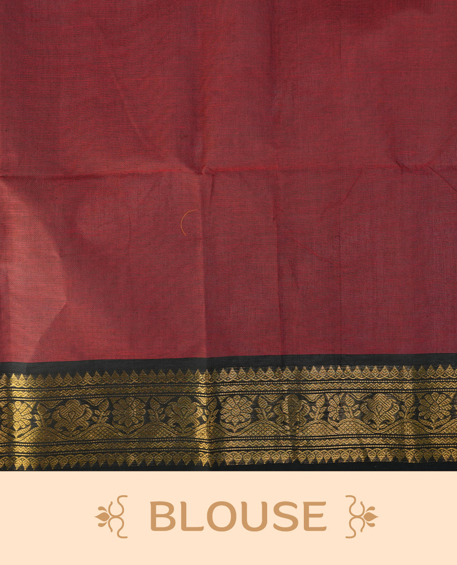 Maroon colour chettinad saree featuring gold zari motifs on body, complemented by contrast black colour with traditional border, paired with matching blouse piece.