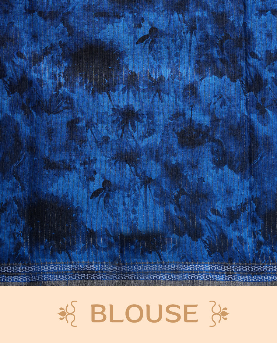 Royal blue colour semi tussar silk saree featuring an abstract digital floral printed body with a rich self border and tasselled pallu, paired with a matching blouse.
