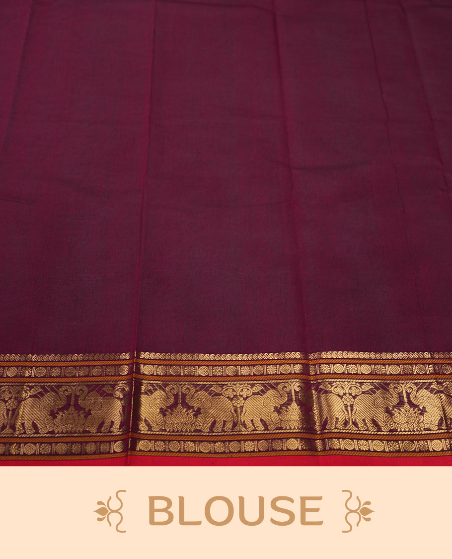 Maroon colour pure Kanchi cotton saree featuring golden checks with floral motifs, enhanced by a grand zari border woven with majestic elephant patterns, exuding elegance and tradition & Comes with matching blouse.