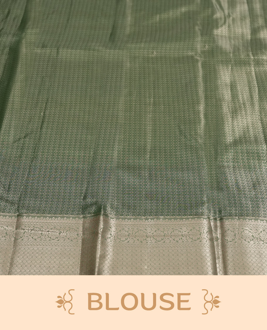 Dull green colour and Antique gold Zari Tissue Brocade Saree features intricate floral Motifs on body and fancy border & pallu with floral patterns, paired with matching blouse