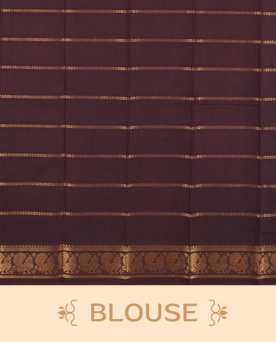 Beige colour Chettinad cotton saree adorned with subtle checked patterns on the body, complemented by an exquisite dark maroon border featuring golden peacock motifs & Paired with a matching blouse piece.