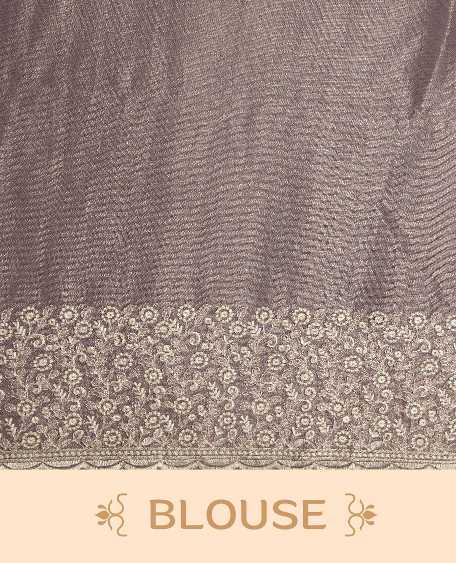 Pastel Purple colour net organza saree featuring white thread embroidery motifs on body and thread detailing on the border and paired matching blouse.