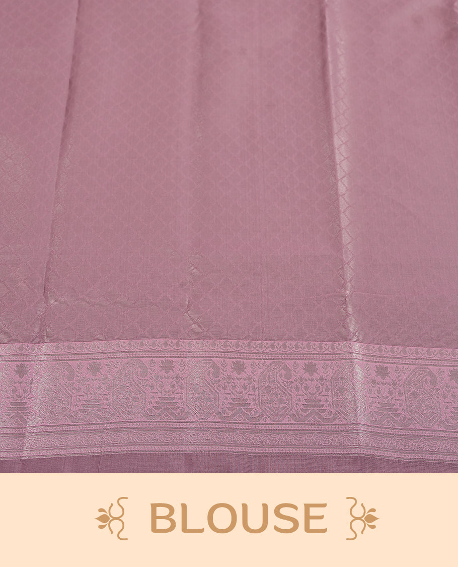Black colour semi silk saree adorned with silver zari designs on the body, complemented by a contrasting light pink border and pallu, and paired with a matching blouse piece