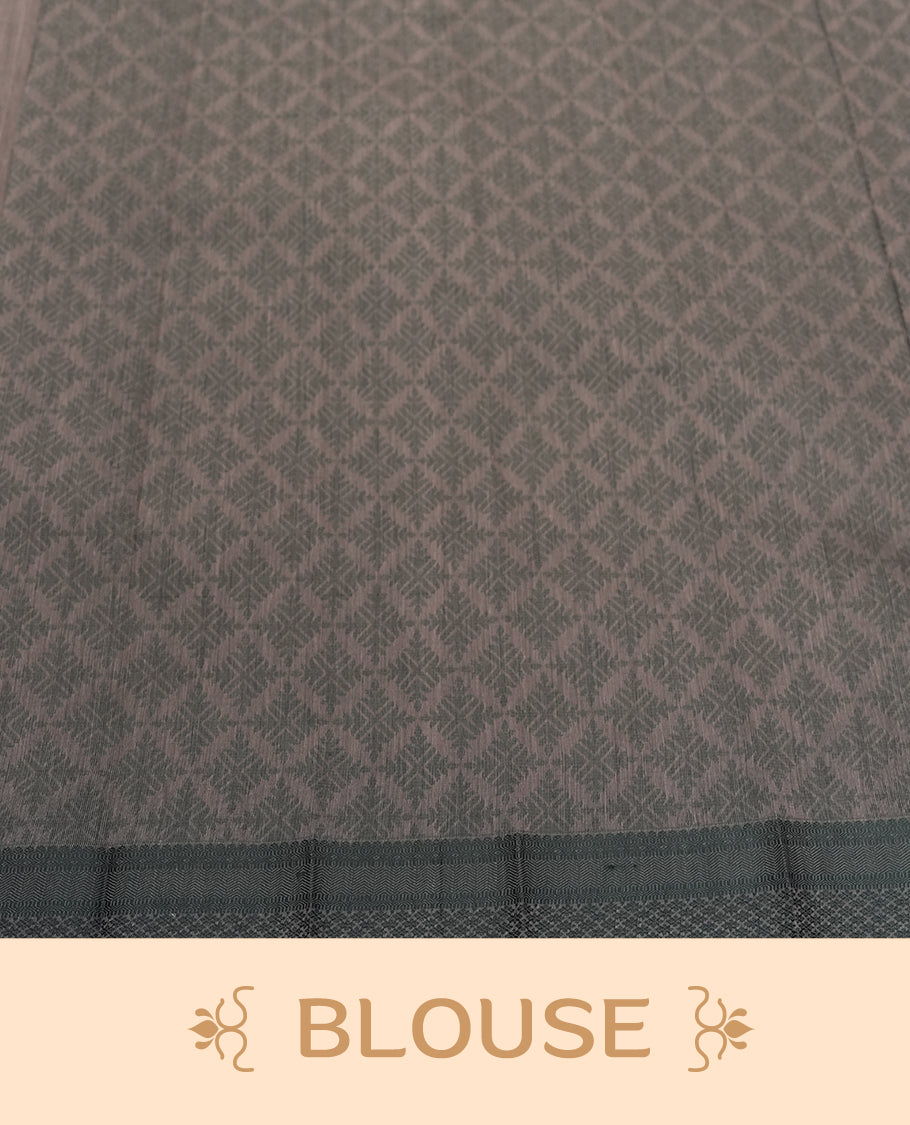 Dusty grey colour silk cotton saree featuring elegant floral zari motifs on the body, complemented by a rich contrast dark greenish border and pallu with traditional woven detailing & Comes with a matching blouse piece.
