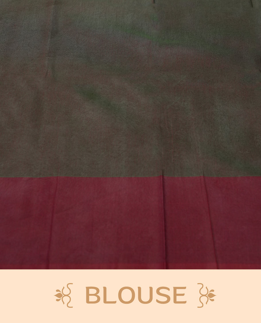 Dark greeen colour soft silk cotton saree adorned with copper zari motifs and a shimmering copper zari border, Enhanced by a beautifully rich maroon colour woven pallu & Comes with a matching blouse piece for a complete look.