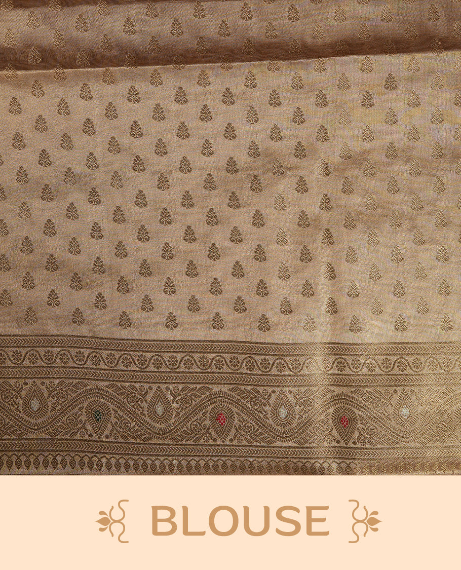 Gold colour tissue banaras silk saree featuring antique gold zari motifs on the body with rich traditional zari border and pallu, paired with a matching blouse piece.