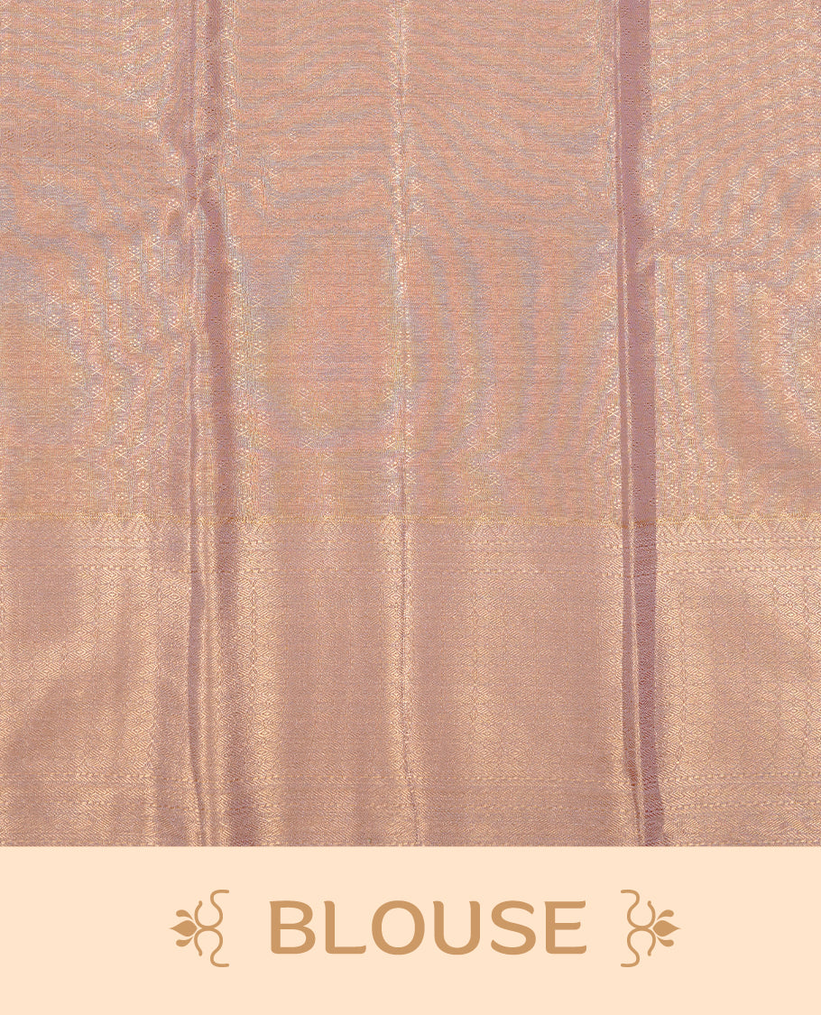 Peachy gold colour tissue silk saree featuring Self colour zari floral pattern on body, enhanced with traditional border on self colour , paired with Matching blouse piece.