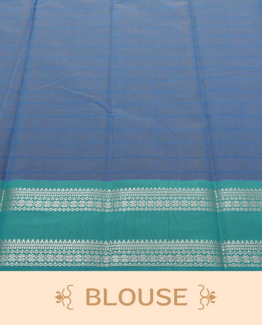 Beige Colour silk cotton saree with checkered body, scattered silver zari leaf buttas, ornate silver zari borders in teal green, diamond lattice pallu with temple motifs, teal green blouse with matching border.
