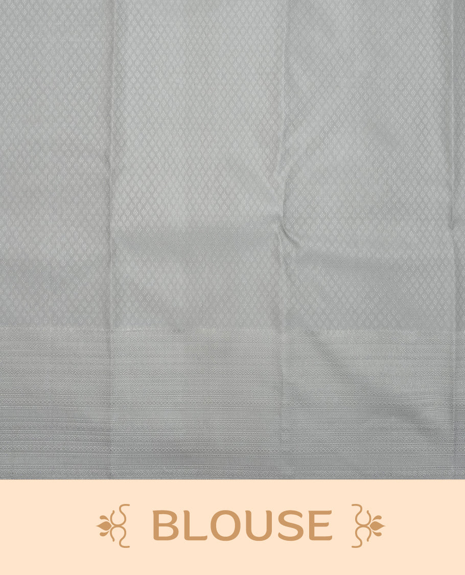 Grey colour pure wedding silk saree featuring Silver zari Floral kodi pattern on body, complemented by self colour with traditional border, comes with matching blouse piece.