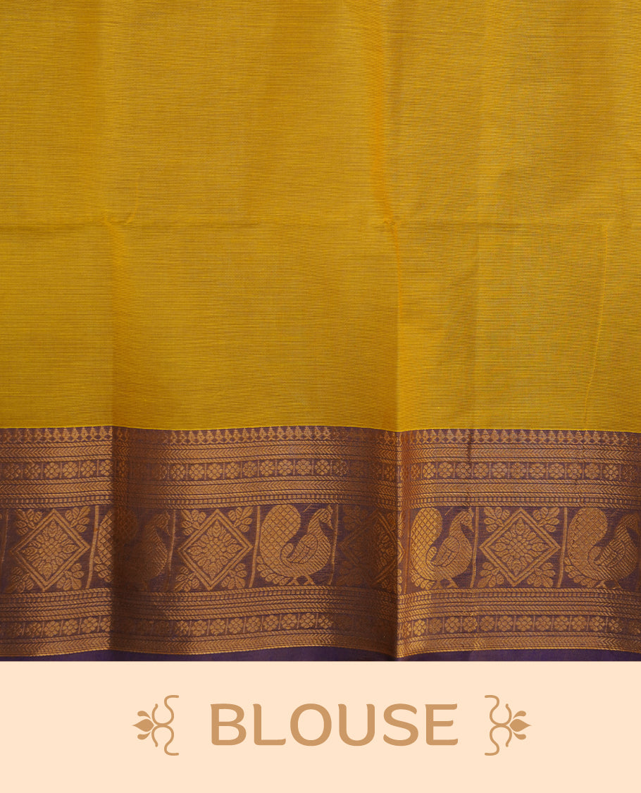 Olive yellow colour chettinad saree featuring gold zari motifs on body, complemented by contrast purple colour with traditional border, paired with matching blouse piece.