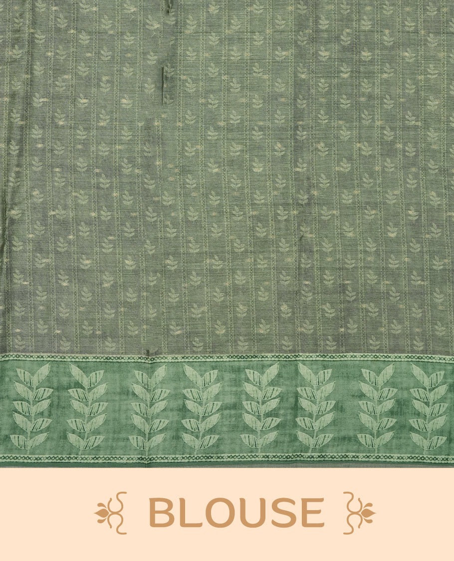 Sage green colour semi tussar saree adorned with Cream Zigzag printed pattern across the body and Leaf pattern on contrast Fern green colour border, paired with a matching blouse.
