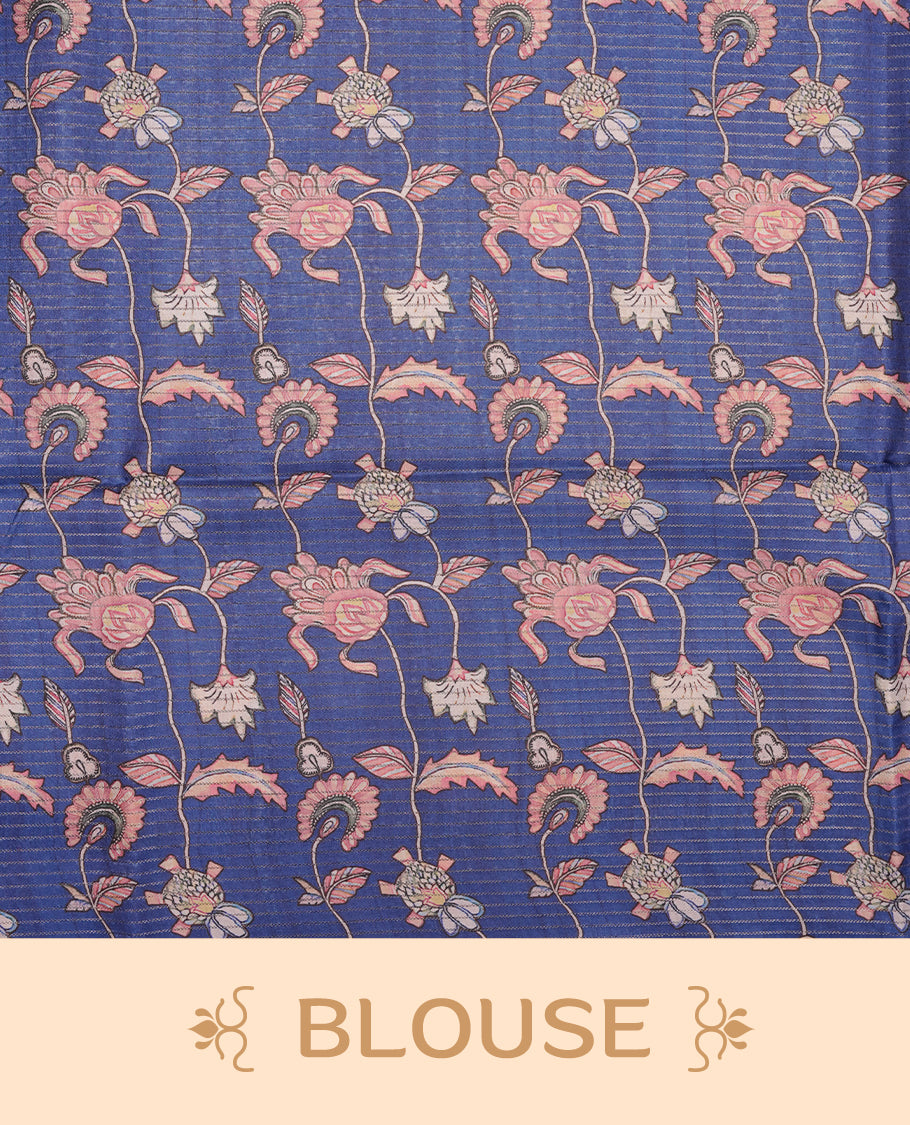 Blue colour semi-tussar silk saree featuring intricate peacock motifs on the pallu, subtle zari check pattern across the body, floral vine prints throughout, finished with tassels and paired with a matching printed blouse piece.