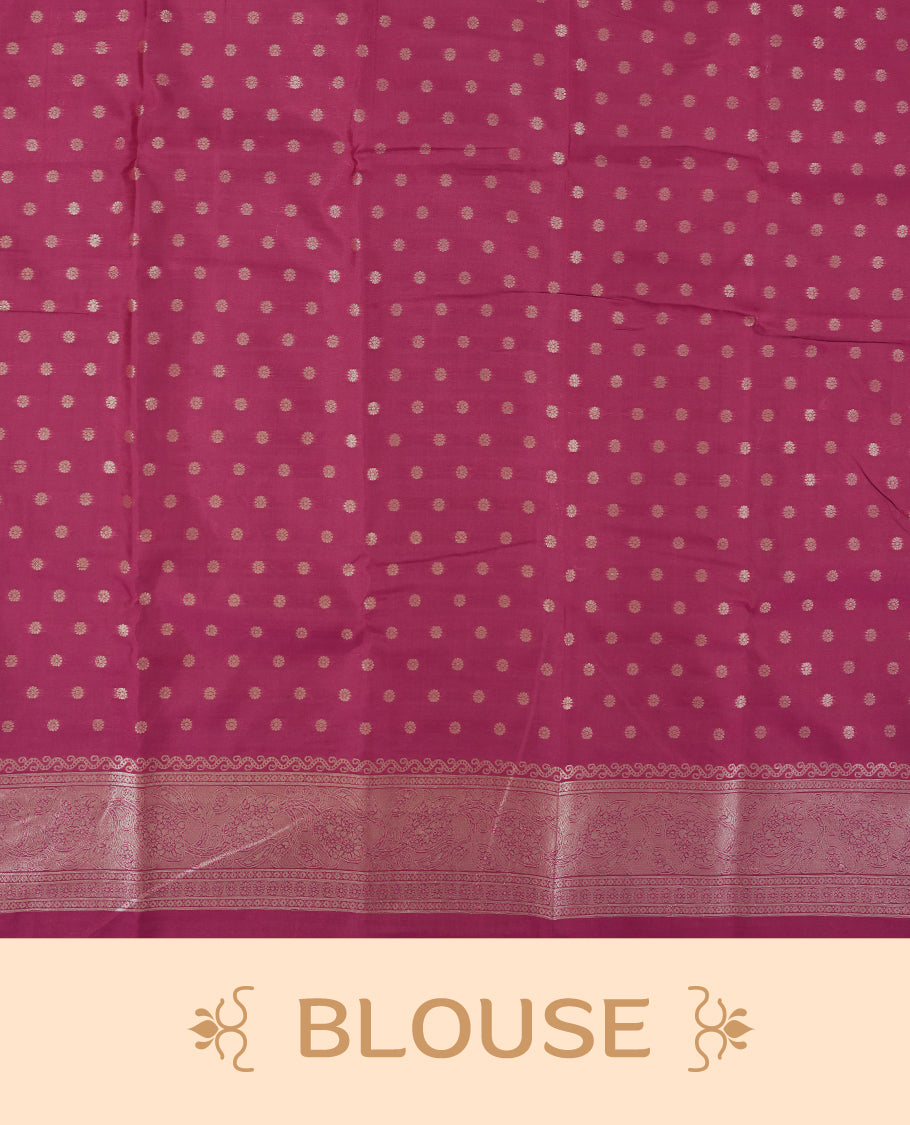 Burgundy colour semi silk saree adorned with elegant floral motifs on the body, complemented by a shimmering golden zari-woven pallu and border, and paired with a matching blouse