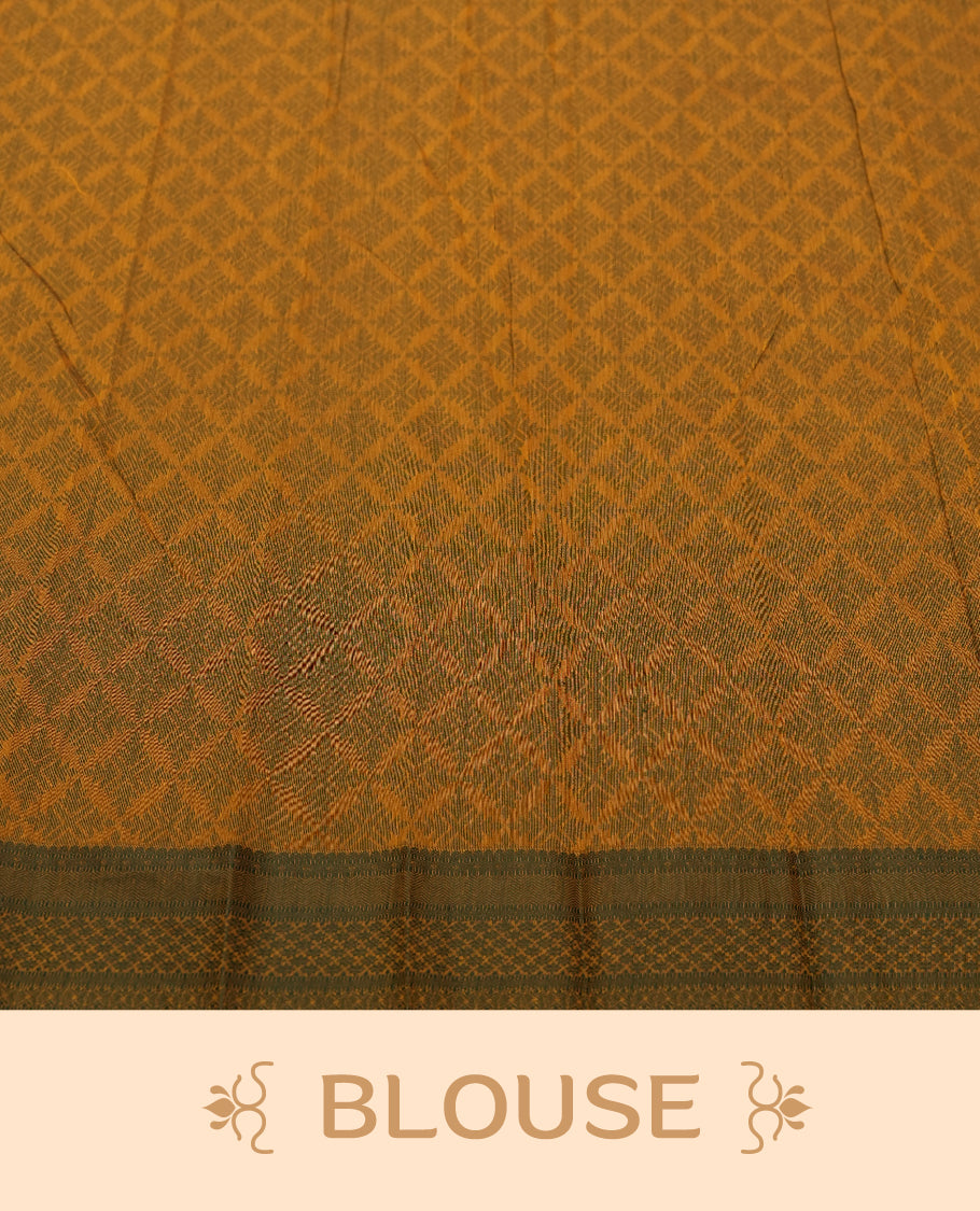 Mustard yellow colour silk cotton saree featuring elegant floral zari motifs on the body, complemented by a rich contrast dark green border and pallu with traditional woven detailing & Comes with a matching blouse piece.