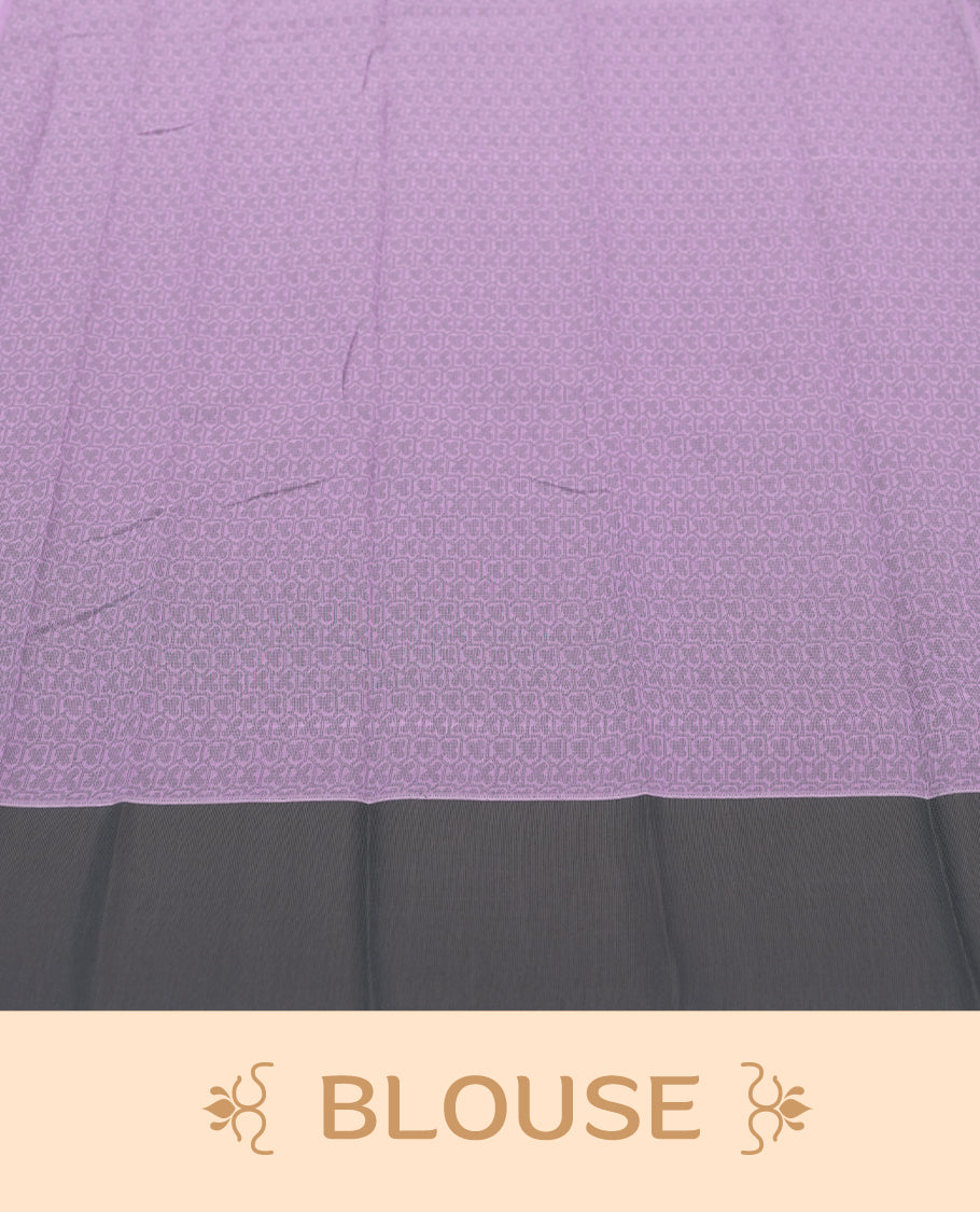 Lavender colour silk cotton saree featuring elegant floral zari motifs on the body, complemented by a rich contrast dark grey border and pallu with traditional woven detailing & Comes with a matching blouse piece.