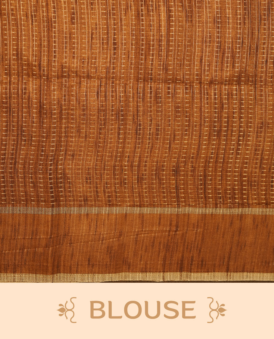 Antique gold colour semi tussar silk saree highlighting gold zari dotted stripes, self colour border and contrast dark gold pallu and comes with matching blouse piece.