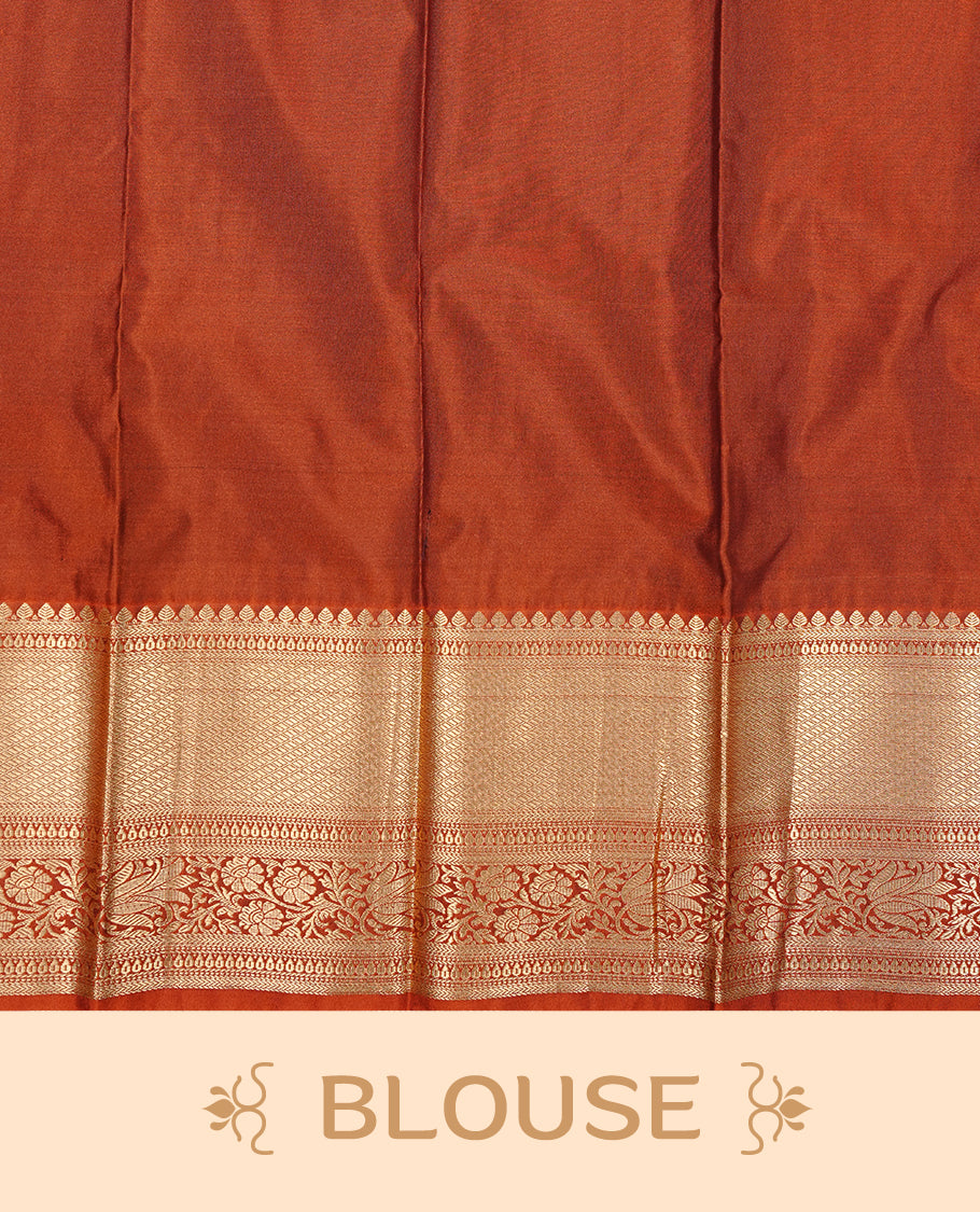 Dark chocolate colour Semi silk saree Featuring gold zari motifs on body, complemented by contrast Orange colour with gold zari border, paired with matching blouse piece.