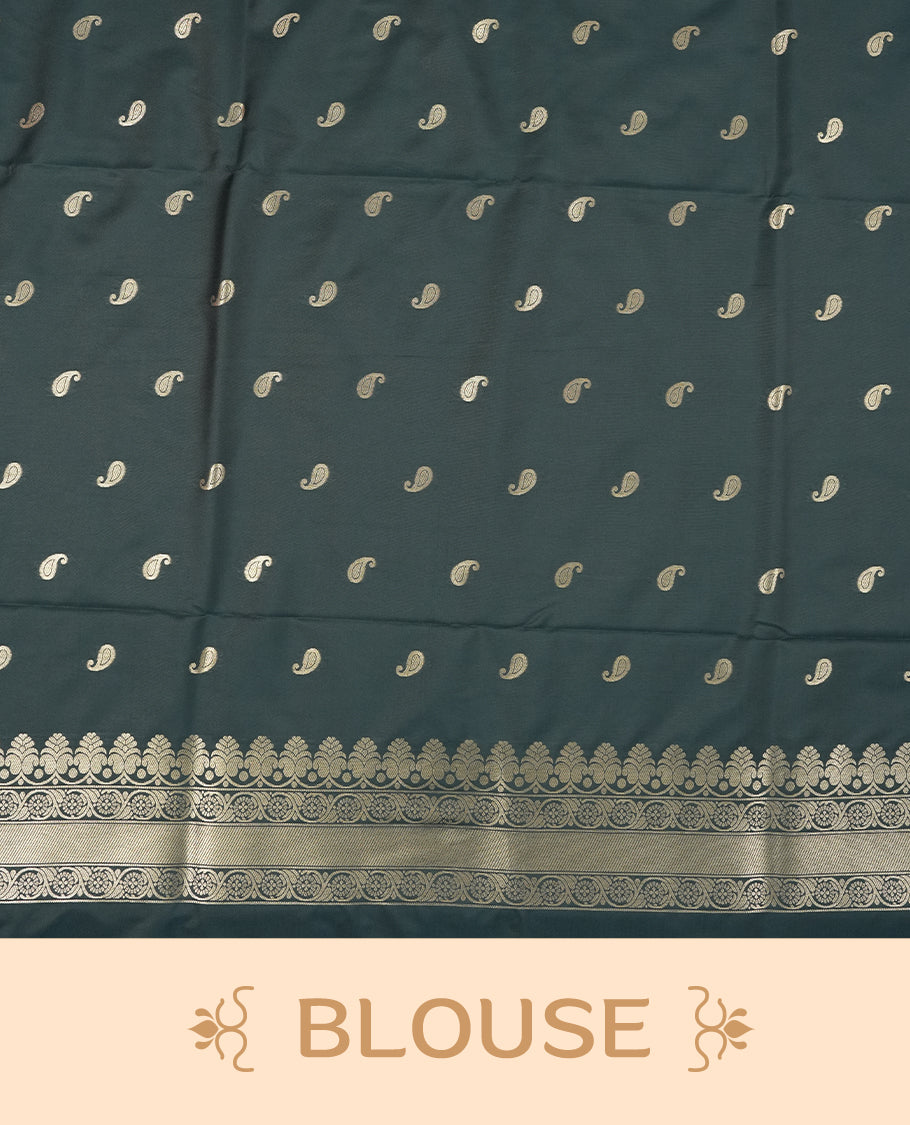 Dark Teal Green colour semi soft silk saree featuring an all-over woven leaf pattern in gold colour, finished with a matching border adorned with detailed paisley and floral motifs, and a matching blouse piece.