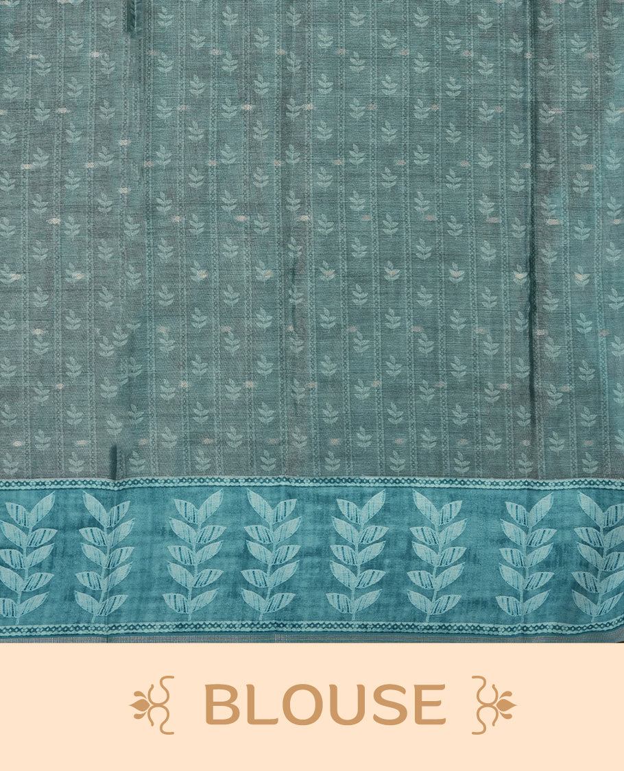 Aqua blue colour semi tussar saree adorned with Cream Zigzag printed pattern across the body and Leaf pattern on contrast aqua blue colour border, paired with a matching blouse.