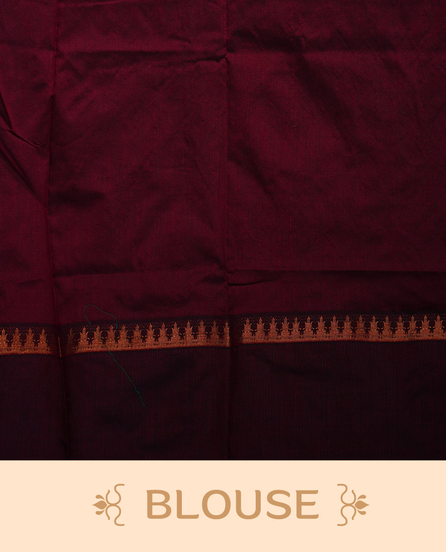Dark Green colour mixed Kalyani cotton saree with zari motifs on the body, maroon zari border and traditional elephant motif pallu, paired with a matching blouse.