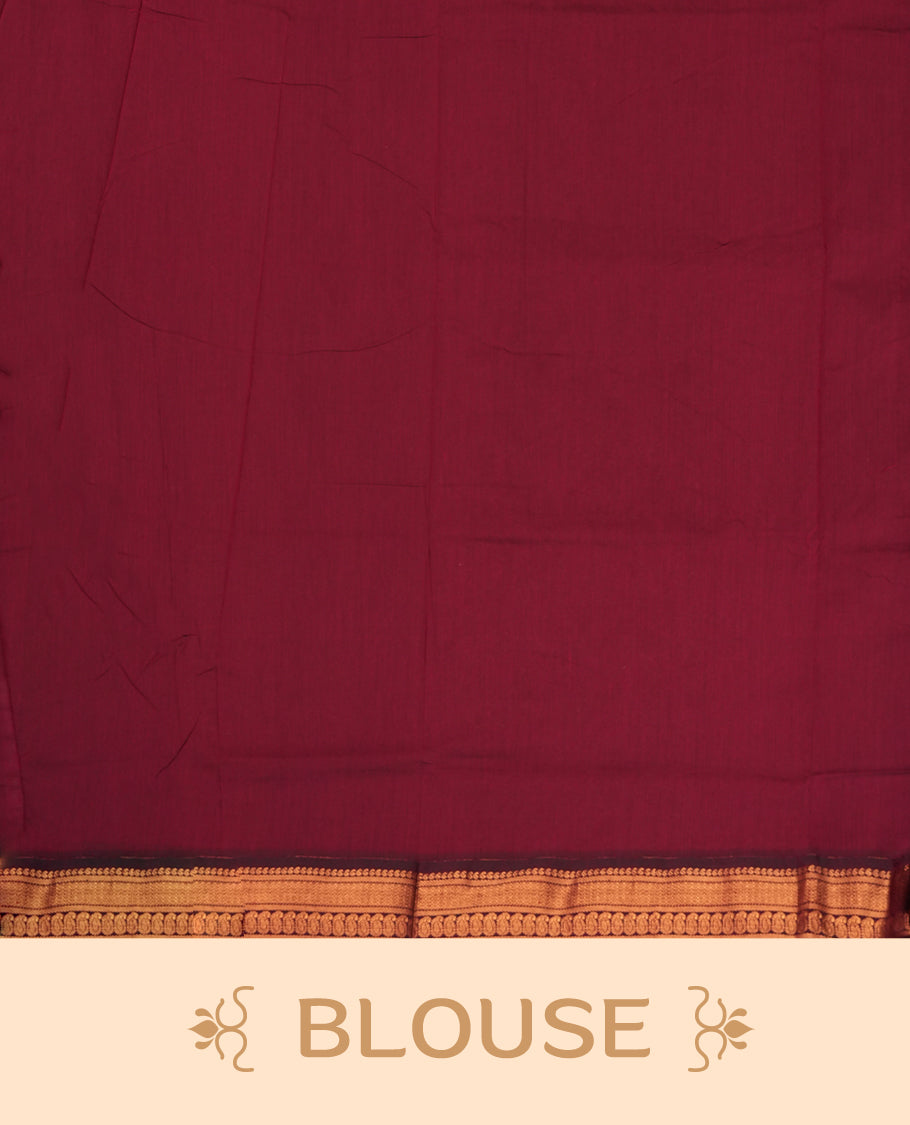Blue colour Kalyani Cotton saree in deep maroon with golden floral motifs, paired with a contrasting maroon border featuring intricate zari work & Comes with a matching blouse piece.